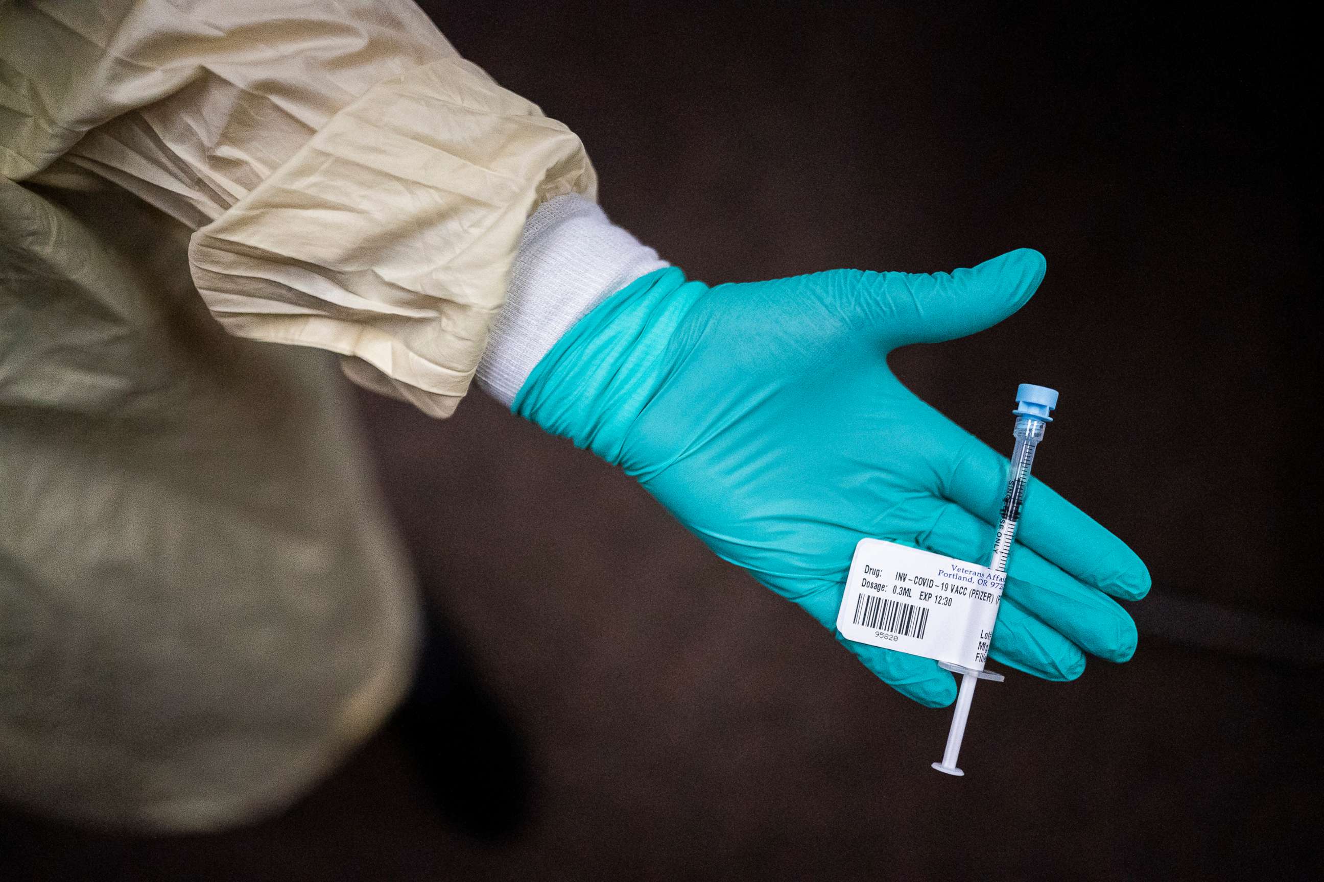 PHOTO: A nurse displays the Pfizer COVID-19 vaccine at a Veterans Affairs long-term care facility on Dec. 17, 2020, in Vancouver, Wash.