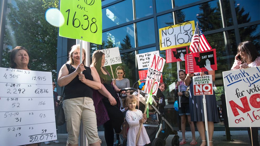 PHOTO: A group of anti-vaccine protesters gather in front of Vancouver City Hall prior to the signing of HB 1638 in Vancouver, Wash., on May 10, 2019.