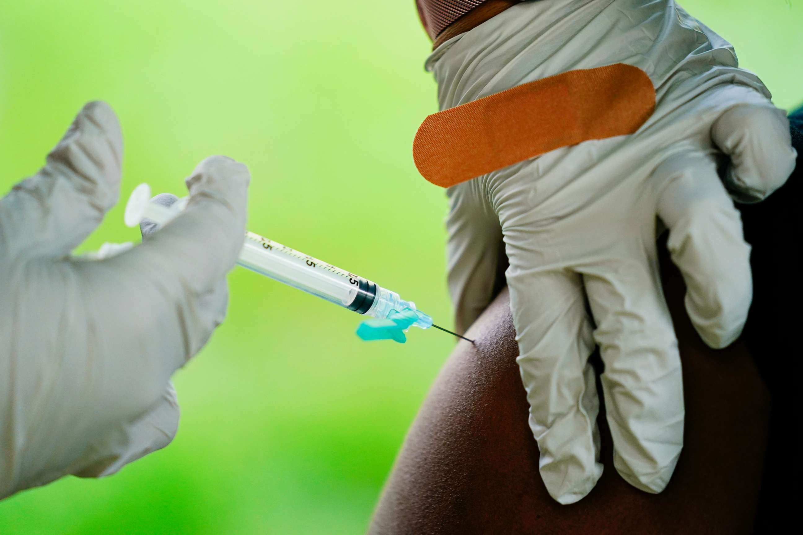 PHOTO: A health worker administers a dose of a Pfizer COVID-19 vaccine during a vaccination clinic at the Reading Area Community College in Reading, Pa., Sept. 14, 2021.