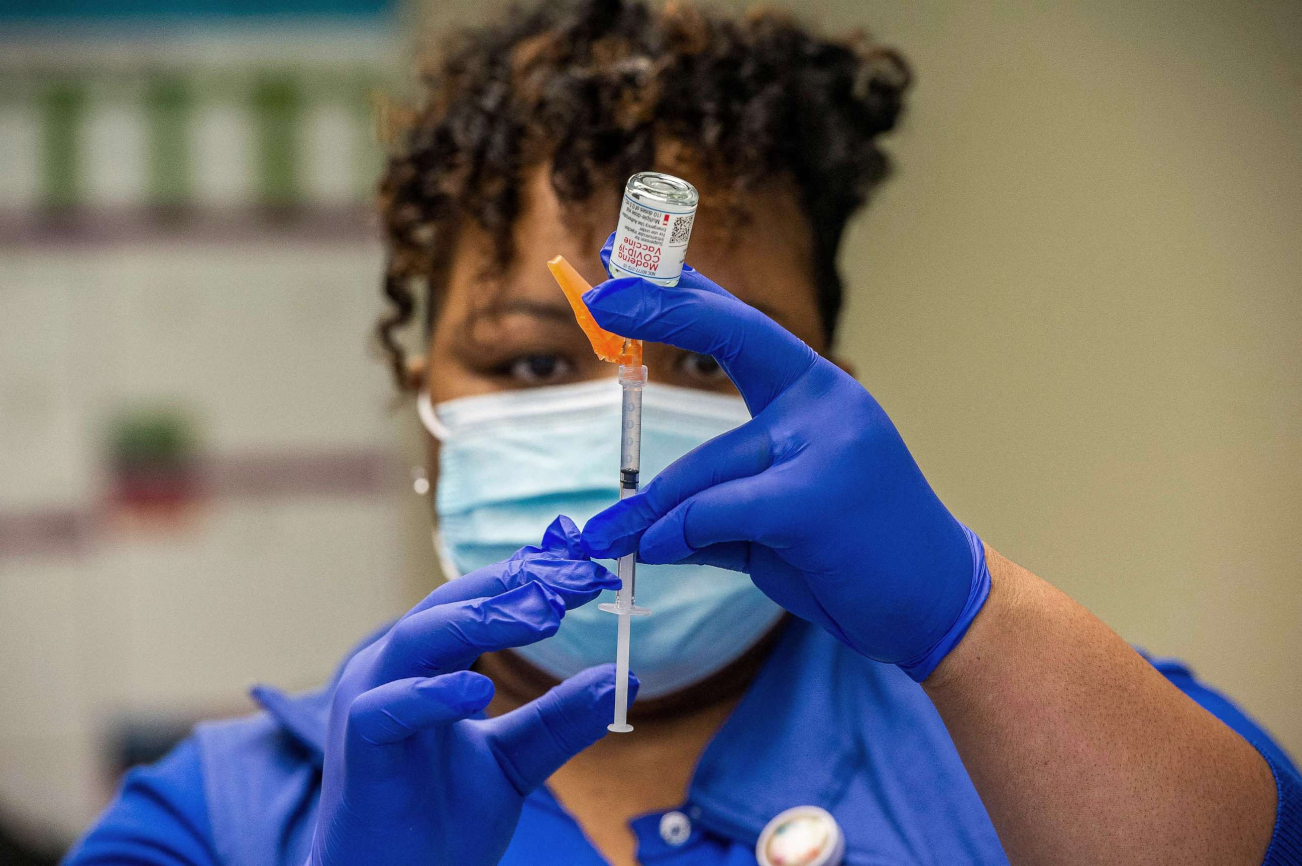 PHOTO: RN Natalie O'Connor loads syringes with the Moderna COVID-19 vaccine before heading out to see patients in Bloomfield, Ct., Feb. 12, 2021.