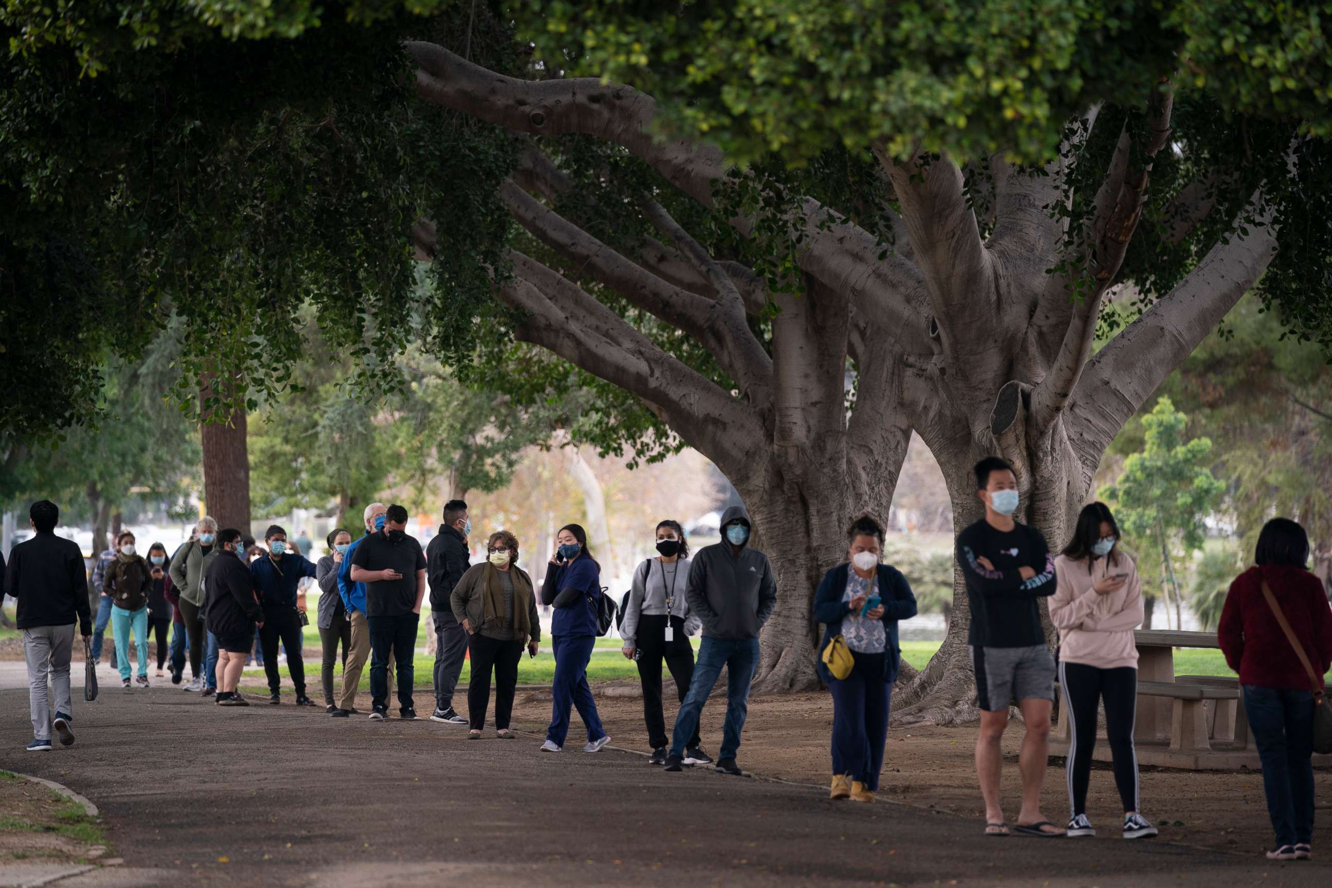 PHOTO: People wait in line to get their COVID-19 vaccine at a vaccination site set up in a park in the Lincoln Heights neighborhood of Los Angeles, Feb. 9, 2021.