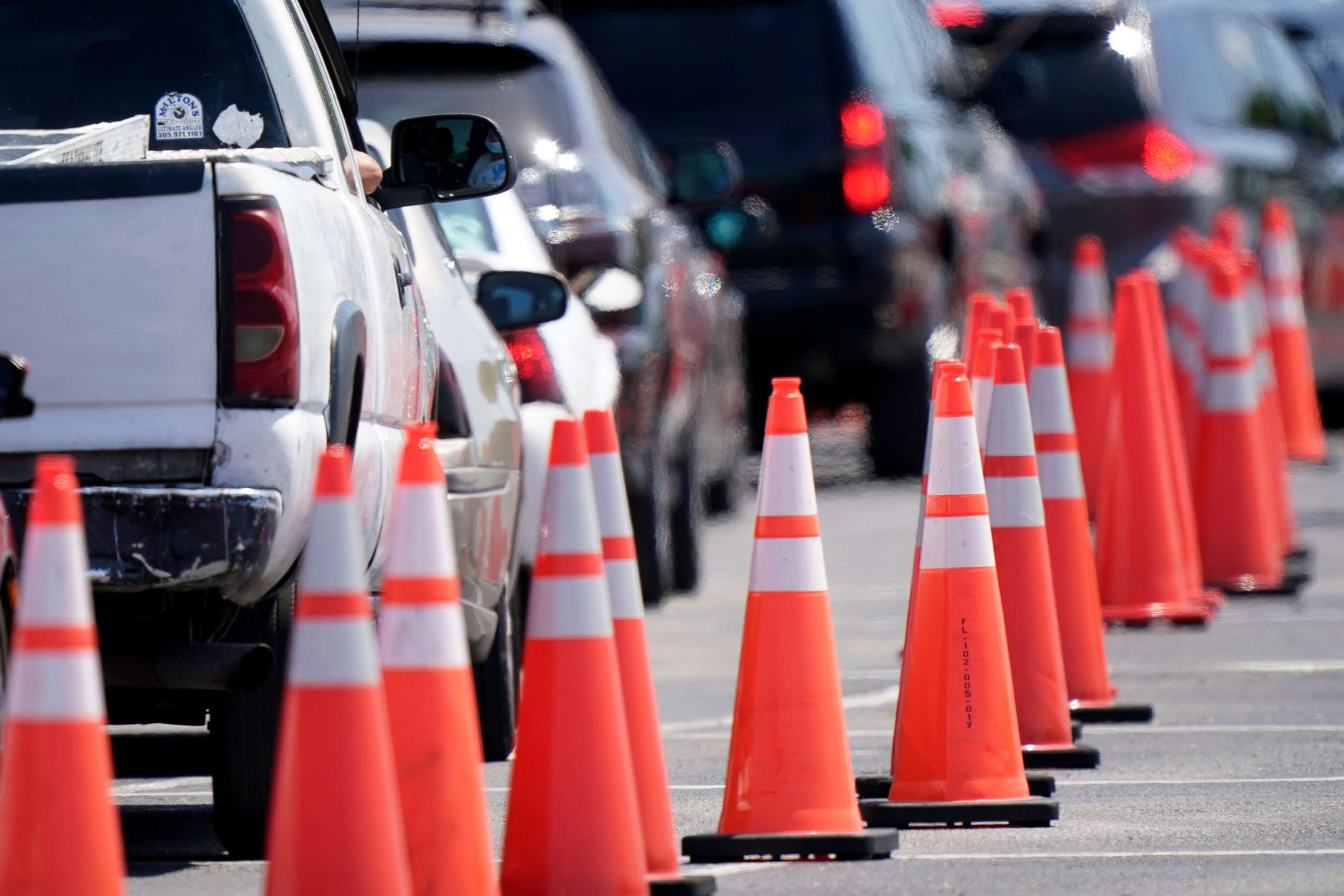 PHOTO: Cars line up at a COVID-19 vaccination site next to Hard Rock Stadium, April 14, 2021, in Miami Gardens, Fla.