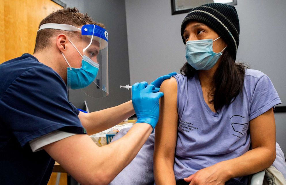 PHOTO: Edith Arangoitia, 46, is vaccinated with the Pfizer-BioNTech Covid-19 vaccine by Doctor Galen Harnden at La Colaborativa in Chelsea, Mass. on Feb. 16, 2021.