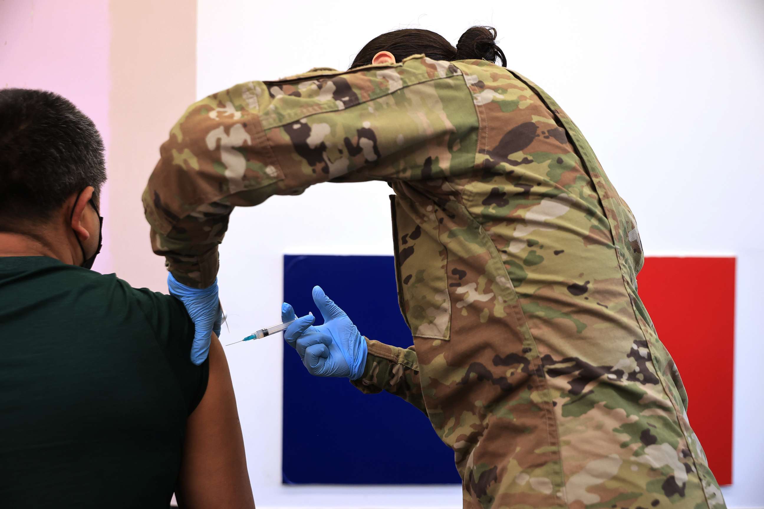 PHOTO: A member of the Maryland National Guard administers a Moderna coronavirus vaccine at CASA de Maryland's Wheaton Welcome Center on May 21, 2021, in Wheaton, Md.