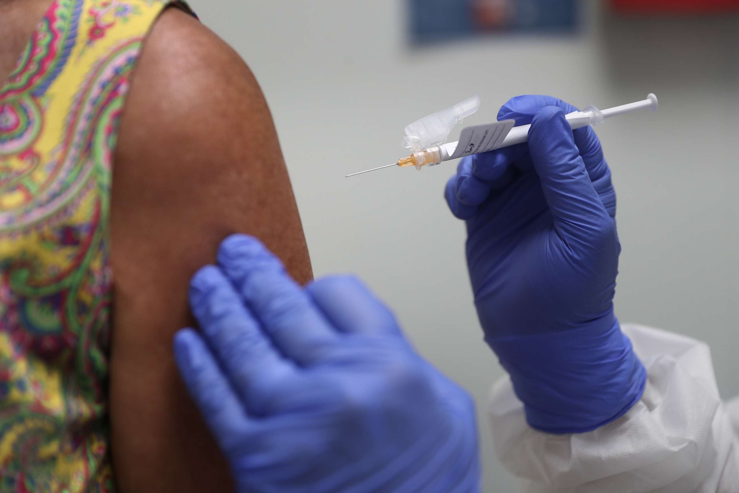 PHOTO: A woman receives a COVID-19 vaccination from nurse Jose Muniz as she takes part in a vaccine study at Research Centers of America on Aug. 7, 2020, in Hollywood, Fla.