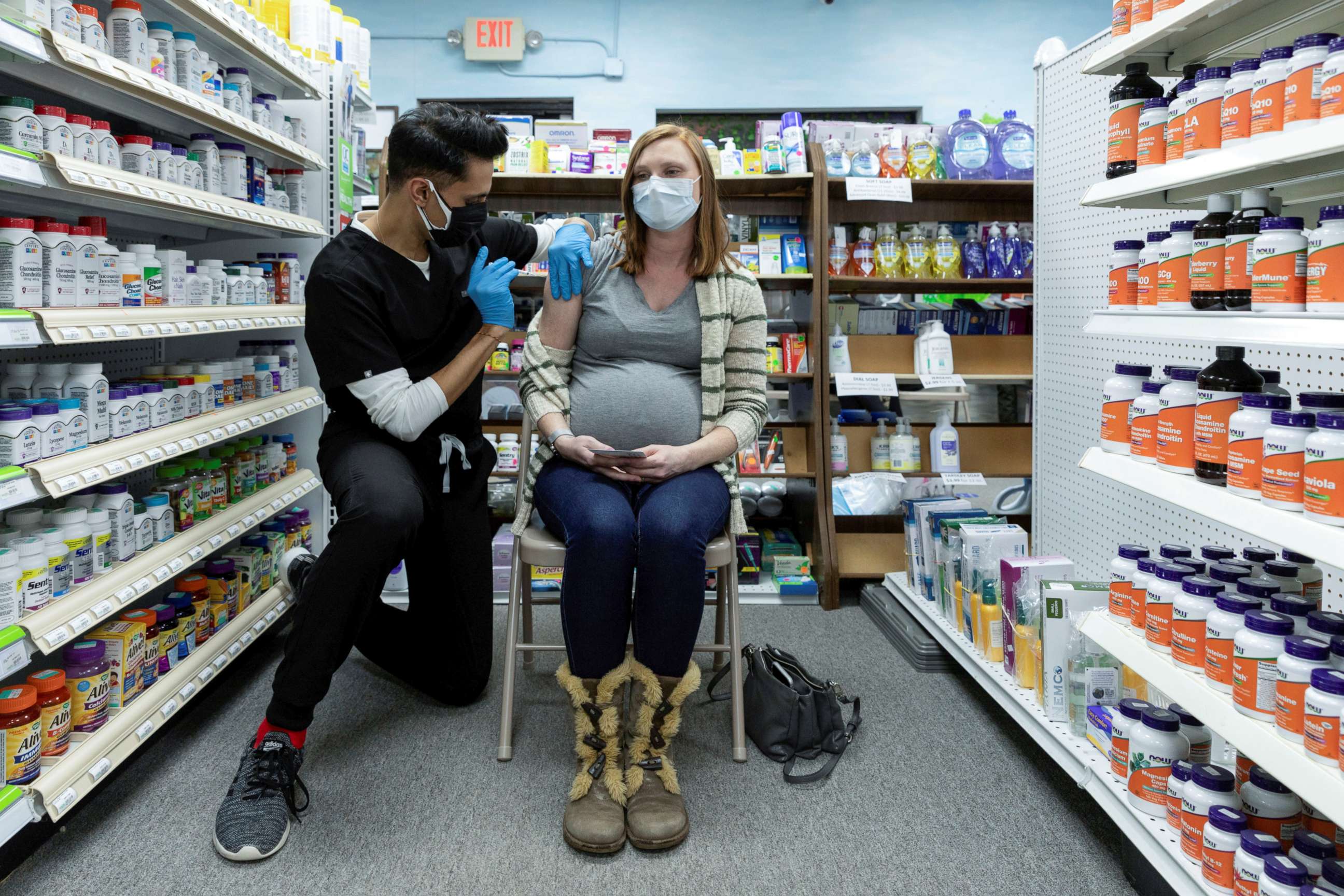 PHOTO: Michelle Melton, who is 35 weeks pregnant, receives the Pfizer-BioNTech vaccine against the coronavirus disease at Skippack Pharmacy in Schwenksville, Pa., Feb. 11, 2021.