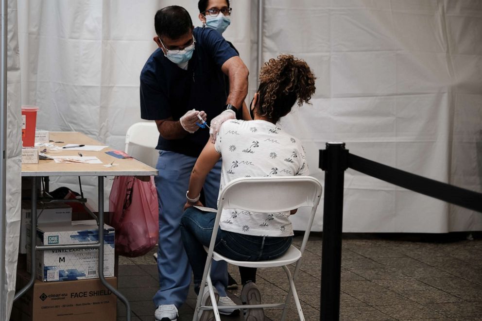 PHOTO: People receive a COVID-19 vaccination shot at the Broadway Junction subway station in Brooklyn, May 12, 2021, in New York.