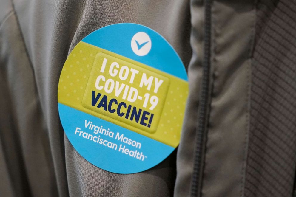 PHOTO: A person wears a sticker after they were given the first of two doses of the Pfizer vaccine for COVID-19, Jan. 24, 2021, at a one-day vaccination clinic set up in an Amazon.com facility in Seattle.