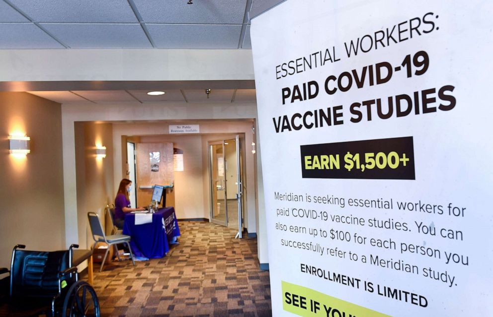 PHOTO: A poster is displayed in the entrance way looking for volunteers as the world's biggest study of a possible COVID-19 vaccine, developed by the National Institutes of Health and Moderna Inc., gets underway, July 27, 2020, in Binghamton, N.Y.