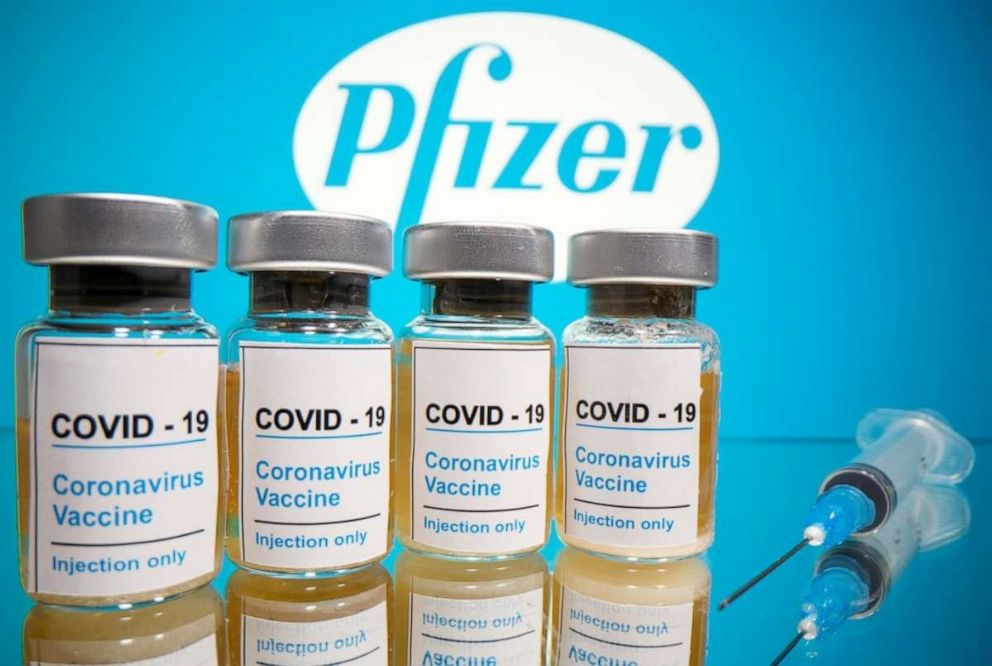 PHOTO: In this Oct. 31, 2020, file photo, COVID-19 vaccine vials are displayed in front of a Pfizer logo.