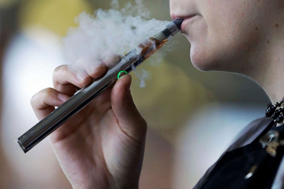 PHOTO: A woman uses an electronic cigarette in Mayfield Heights, Ohio, Oct. 4, 2019.