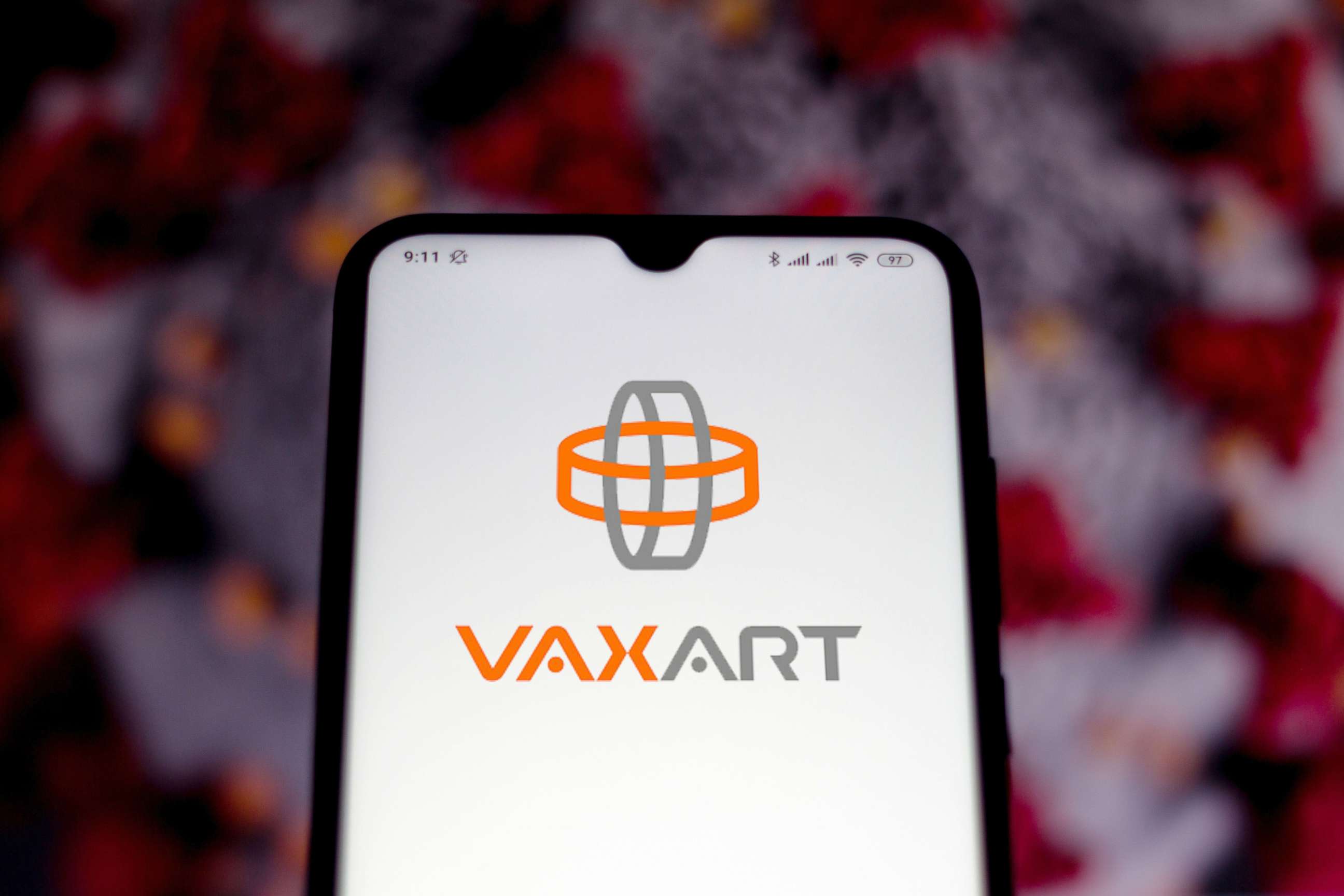PHOTO: The Vaxart logo displayed on a smartphone. 
