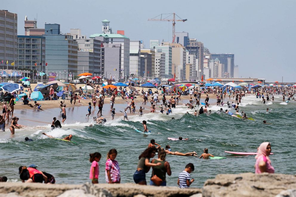 PHOTO: Beachgoers crowd the shoreline along the oceanfront on June 29, 2020, in Virginia Beach, Va.