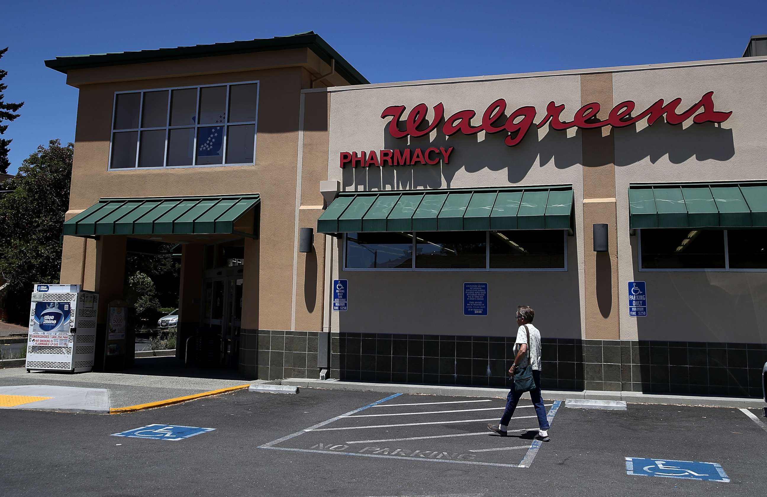 PHOTO: A customer enters a Walgreens store, on June 29, 2017, in San Anselmo, Calif. 
