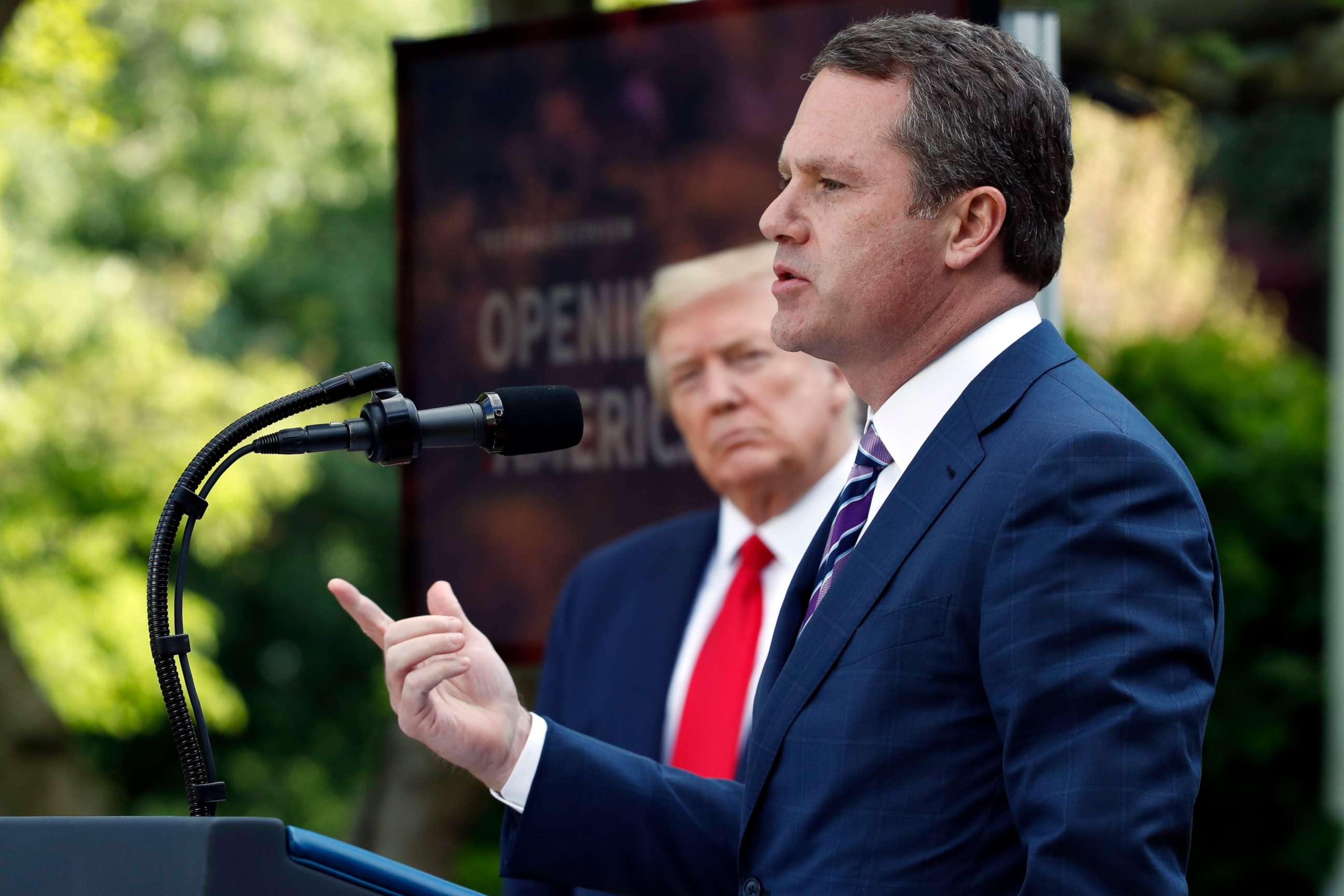 PHOTO: President Donald Trump listens as Doug McMillon, CEO of Walmart, speaks about the coronavirus in the Rose Garden of the White House, Monday, April 27, 2020, in Washington. 