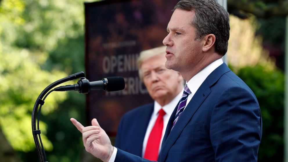 PHOTO: President Donald Trump listens as Doug McMillon, CEO of Walmart, speaks about the coronavirus in the Rose Garden of the White House, Monday, April 27, 2020, in Washington. 