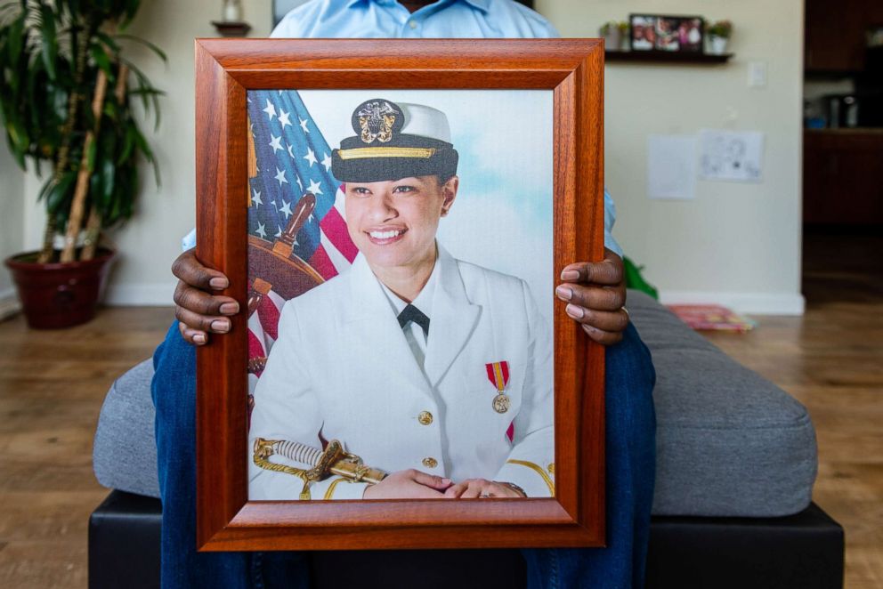 PHOTO: Walter Daniel, a former Coast Guard officer, holds a photograph of his wife, Navy Lt. Rebekah Daniel, known as "Moani."