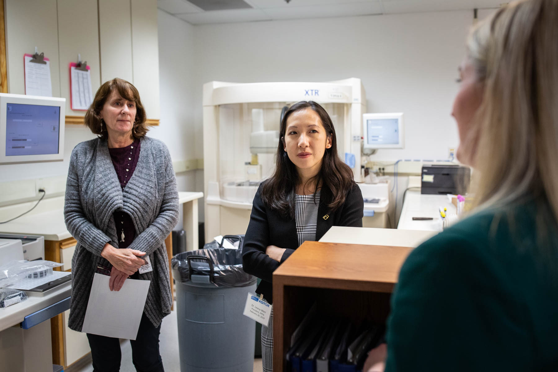PHOTO: Dr. Leana Wen, president of Planned Parenthood, speaks with staff of Planned Parenthood Mar Monte in a basement lab that runs tests for gonorrhea and chlamydia. 