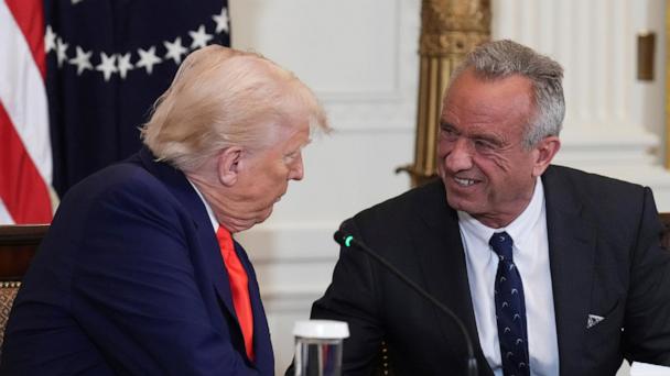 President Donald Trump, left, and Health and Human Services Secretary Robert F. Kennedy Jr. attend a Make America Healthy Again (MAHA) Commission Event in the East Room of the White House, Thursday, May 22, 2025, in Washington. (AP Photo/Jacquelyn Martin)