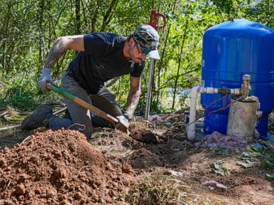 After hurricane, with no running water, residents organize to meet a basic need