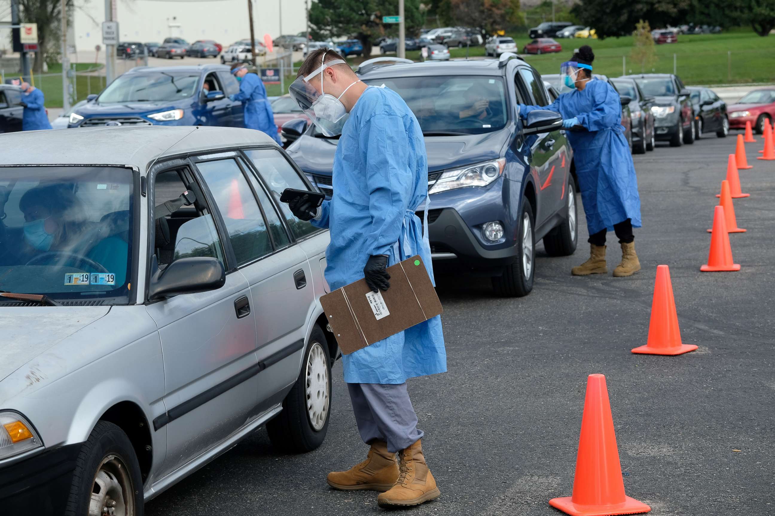 PHOTO: People line up in their vehicles to undergo the coronavirus disease tests, distributed by the Wisconsin National Guard at the United Migrant Opportunity Services center, in Milwaukee, Oct. 2, 2020.
