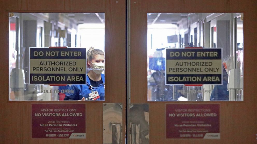 PHOTO: Doors to a COVID-19 treatment unit at UW Health in Madison, Wis. caution hospital personnel and visitors, Nov. 5, 2020.