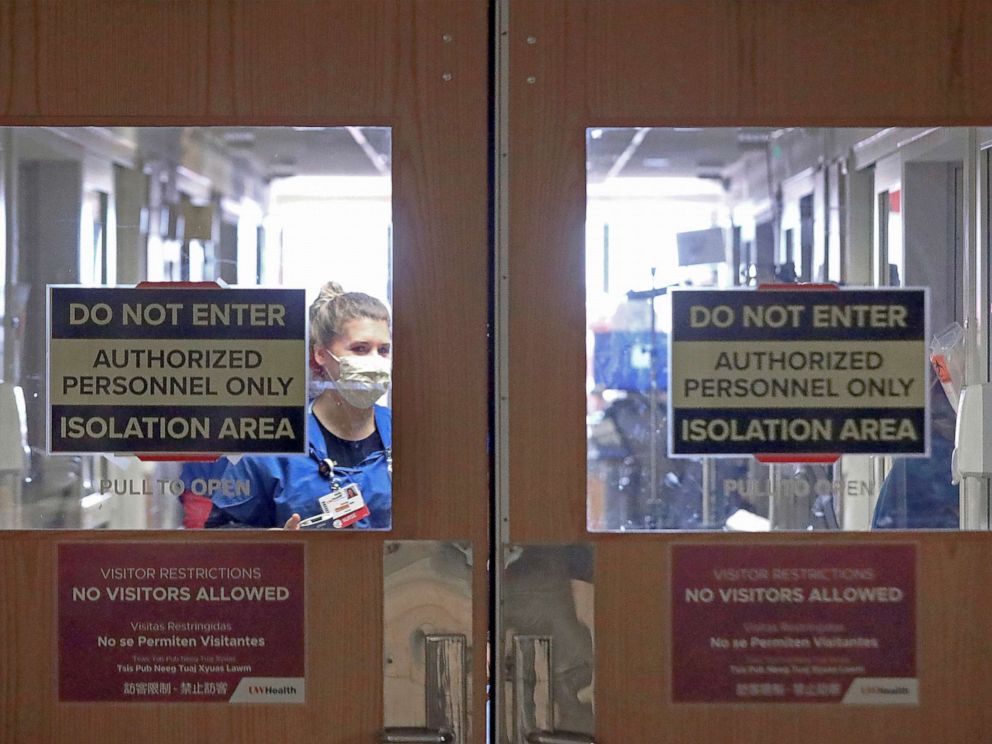PHOTO: Doors to a COVID-19 treatment unit at UW Health in Madison, Wis. caution hospital personnel and visitors, Nov. 5, 2020.