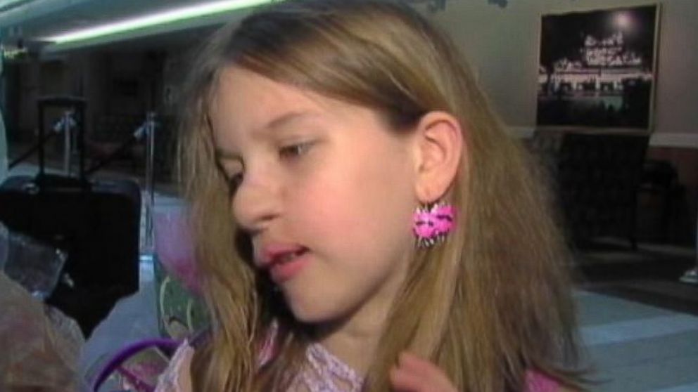 PHOTO: Charlotte wears two earrings in her left ear, while she waited for her right ear to be attached. 