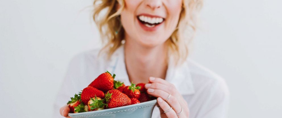 PHOTO: A woman eats strawberries in this undated stock photo.