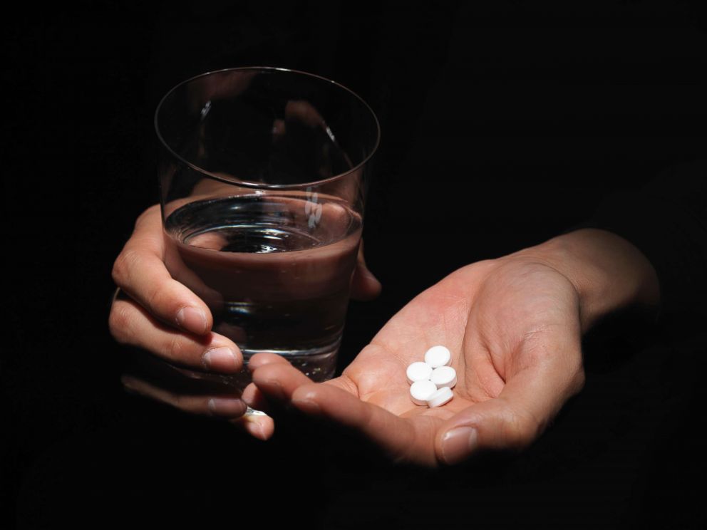 PHOTO: In this stock photo, a young woman holds pills in her hand in this undated image.