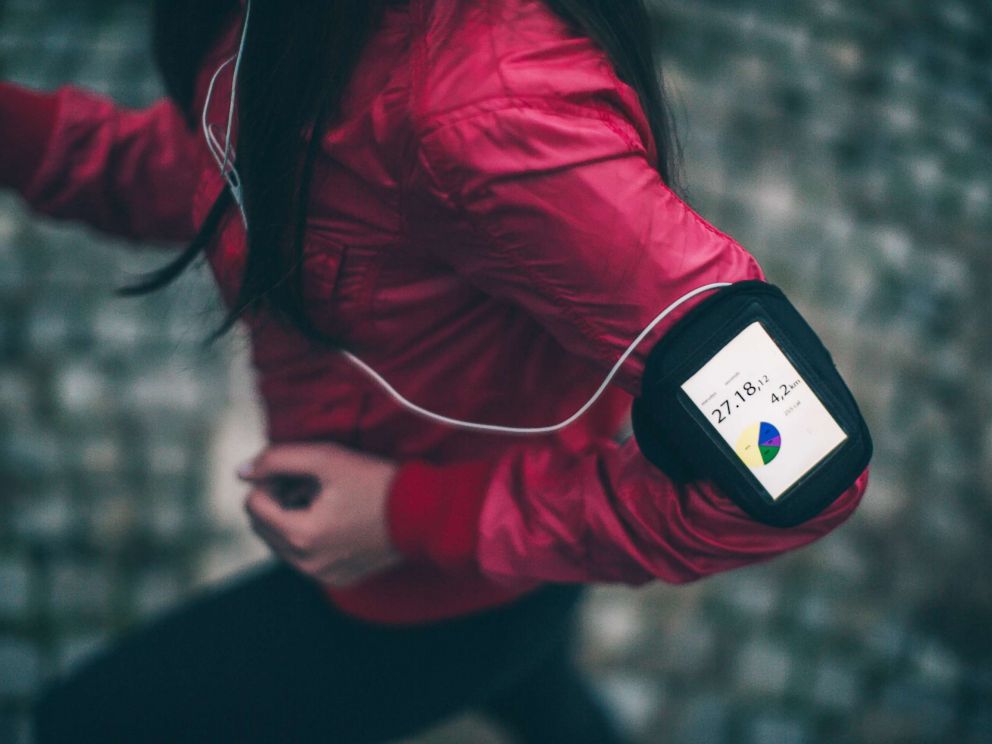PHOTO: Woman exercising with a funning app on her smartphone.