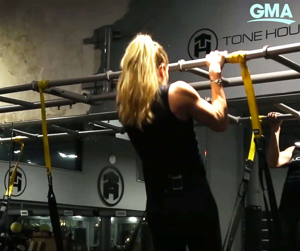 PHOTO: A Tone House trainer demonstrates a pull up.