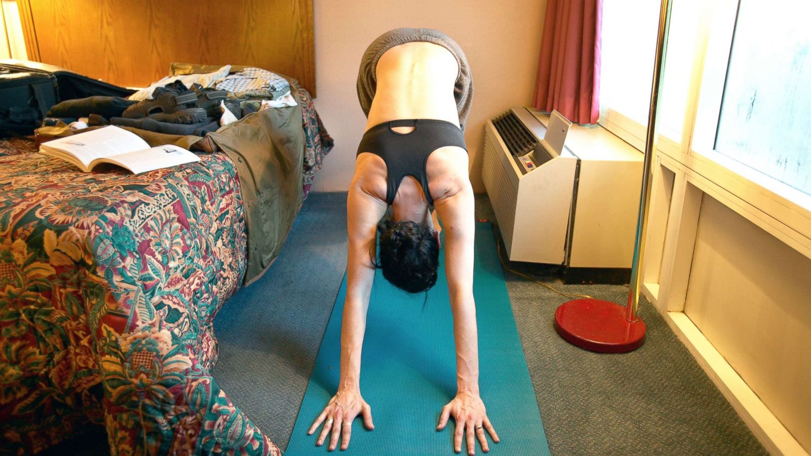 PHOTO: A woman works out in a hotel room in this undated stock photo.