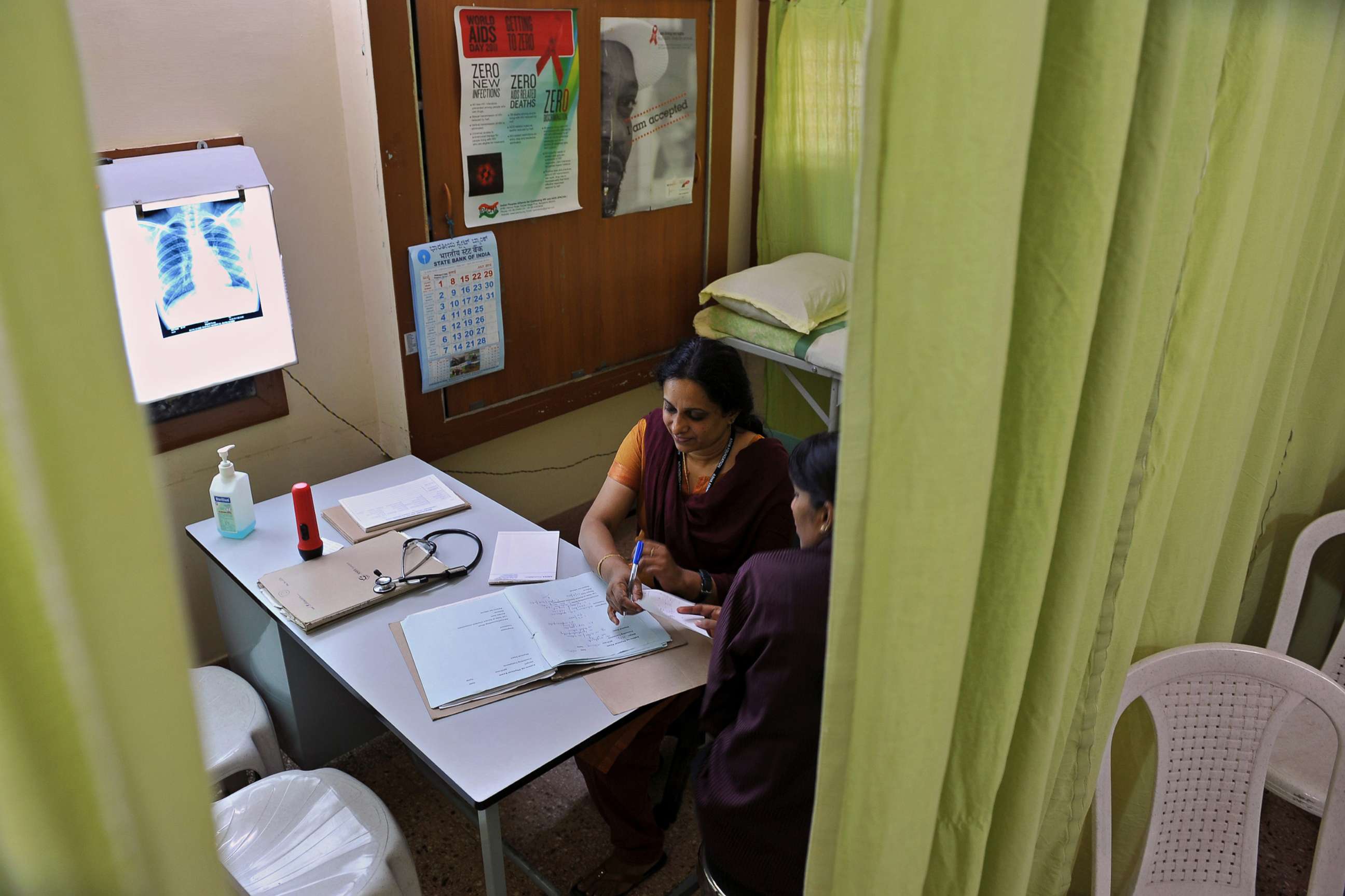 PHOTO: An HIV-positive patient consults a doctor during a medical check-up at the Anti Retroviral Therapy (ART) clinic in Bangalore, India, July 20, 2012. 
