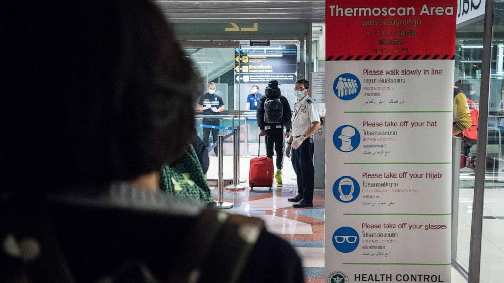 PHOTO: Public Health Officials run thermal scans on passengers arriving from Wuhan, China at Suvarnabumi Airport, Jan. 8, 2020, in Bangkok, Thailand.