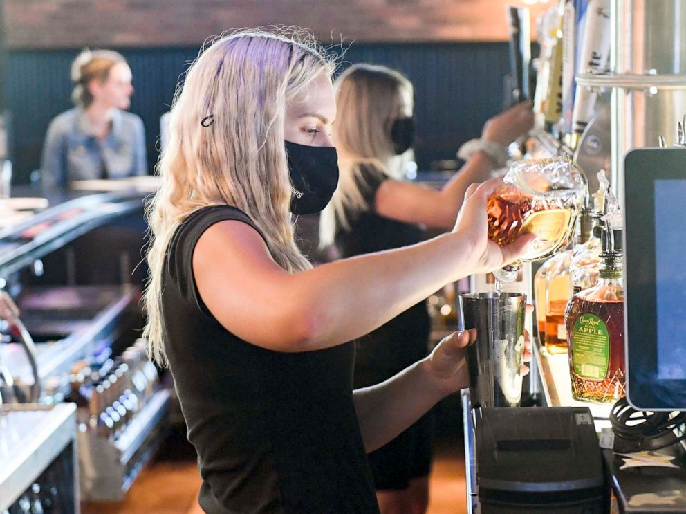 PHOTO: A bartender prepares a drink for a customer at the bar in Spring Township, Pa.,  June 25, 2021.