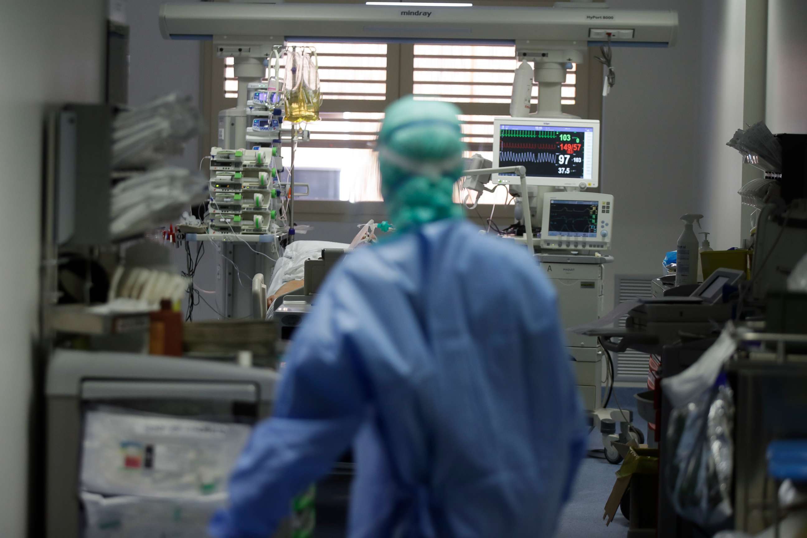 PHOTO: In this photo taken on March 16, 2020, a doctor watches a coronavirus patient under treatment in the intensive care unit of the Brescia hospital in Italy.