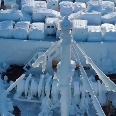 A ship caked in ice makes eye-catching entrance as it docks in the far east Russian port city of Vladivostok.