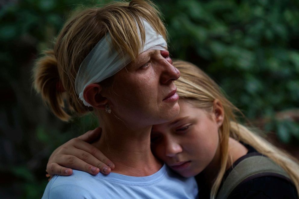 PHOTO: Nelia Fedorova, left, is embraced by her daughter, Yelyzaveta Gavenko, after a Russian rocket attack in Kramatorsk, Donetsk region, eastern Ukraine, Aug. 13, 2022. The strike killed three people and wounded 13 others, according to the mayor.
