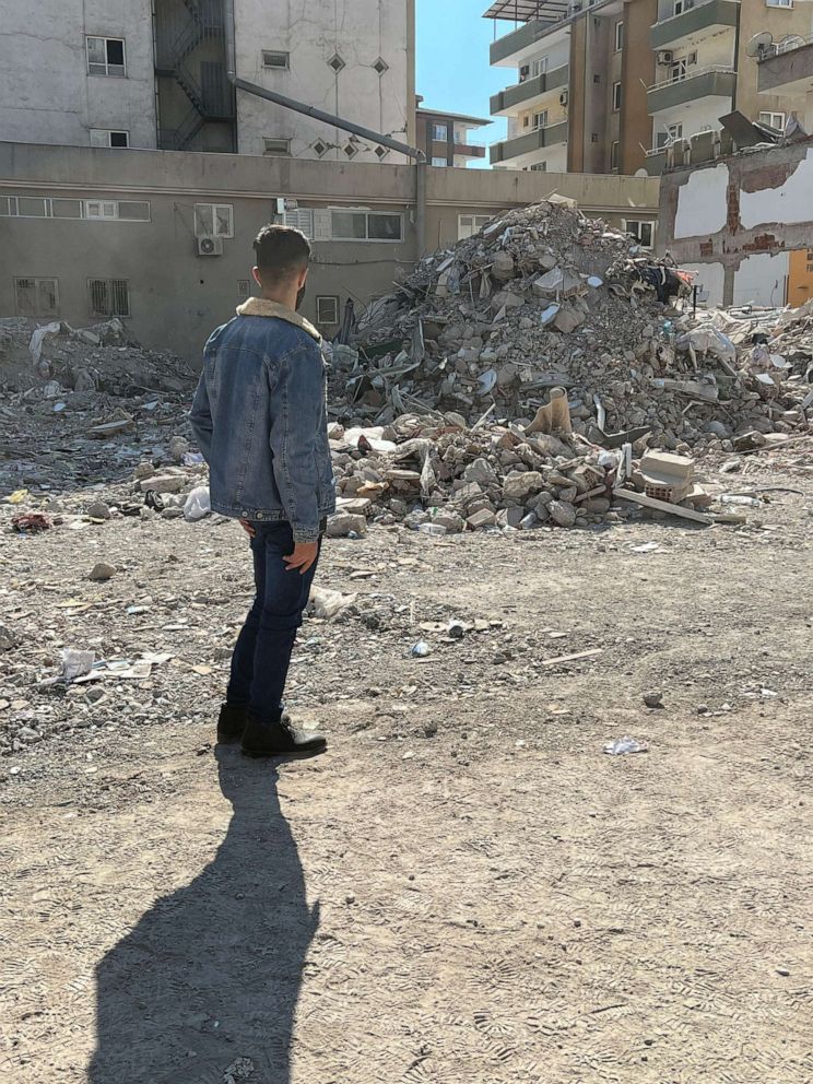PHOTO: Adnan, 17, returns to the place where his home once stood after being pulled out alive from the rubble after four days, in Gaziantep, Turkey.