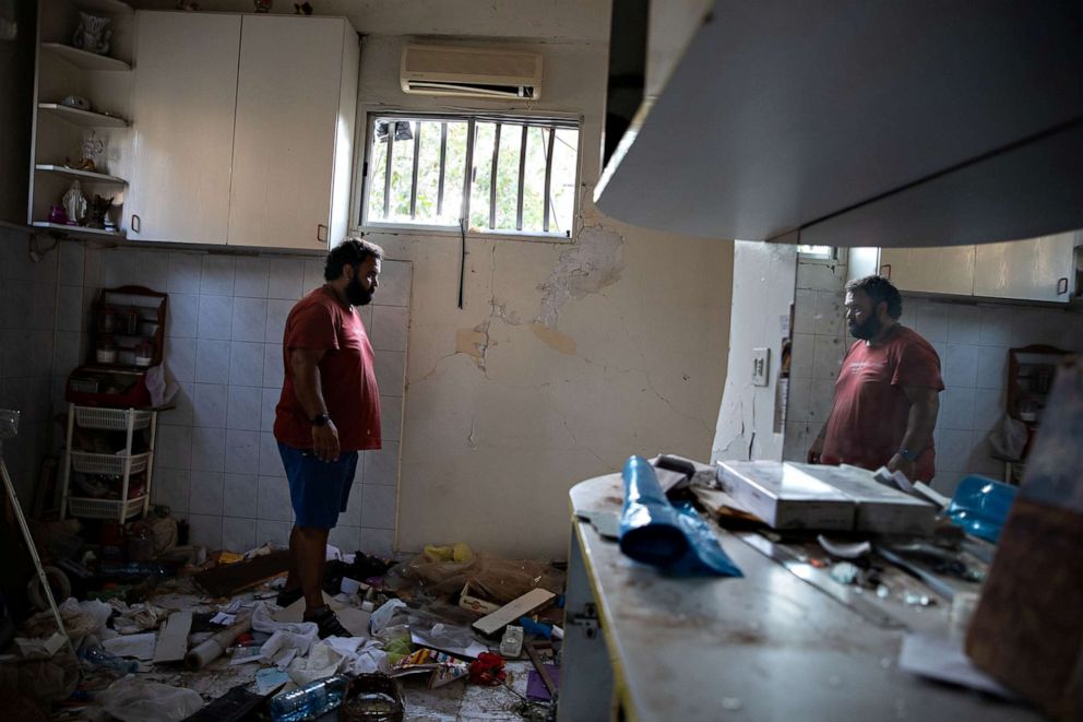 PHOTO: Johnny Khawand, 40, stands amongst the remains of his kitchen in his home in Karantina, Aug. 13, 2020.