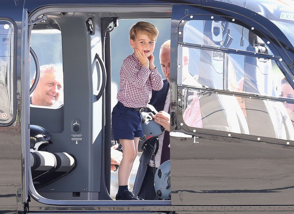 PHOTO: Prince George of Cambridge reacts as the royals view helicopter models before departing from Hamburg airport on the last day of their official visit to Poland and Germany on July 21, 2017, in Hamburg, Germany. 