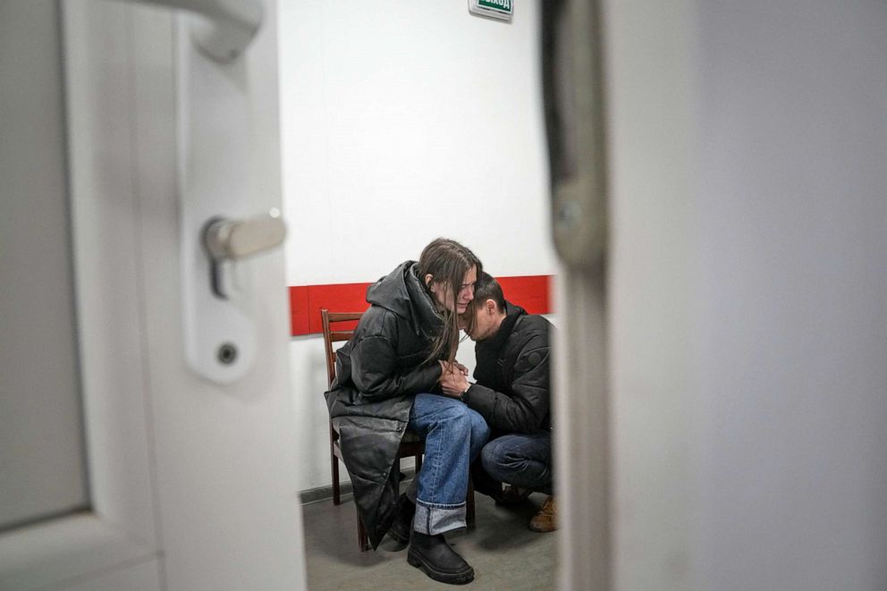 PHOTO: Marina Yatsko and her boyfriend Fedor comfort each other after her 18-month-old son Kirill was killed in shelling in a hospital in Mariupol, Ukraine, March 4, 2022. 