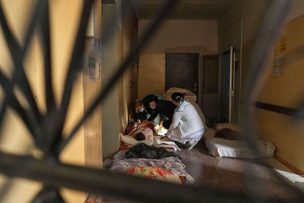 PHOTO: Medical workers treat a man wounded by shelling in a hospital in Mariupol, Ukraine, March 4, 2022.