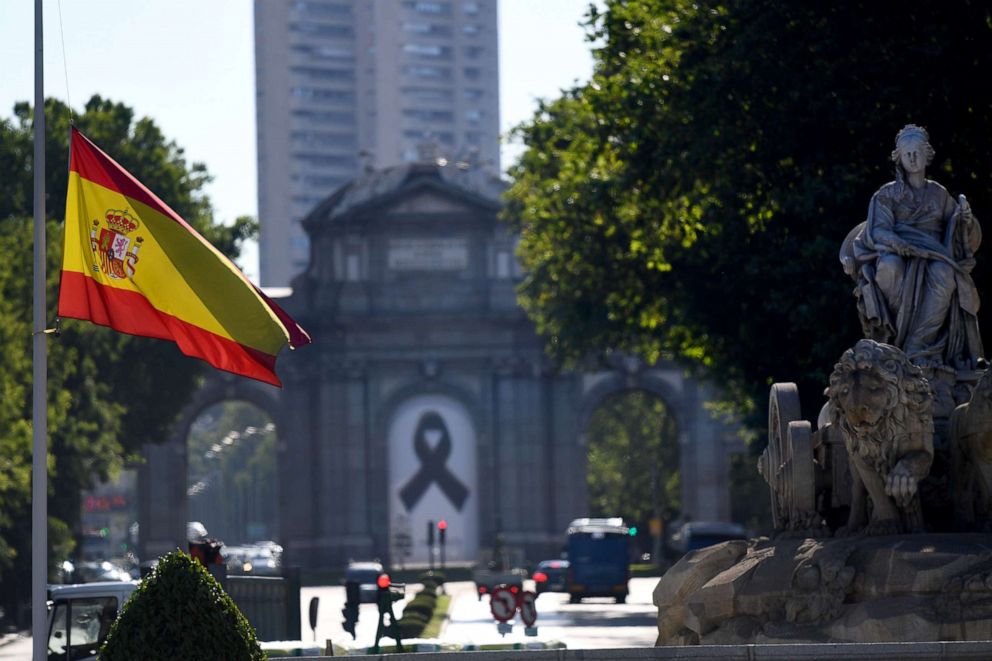 PHOTO: The Spanish flag flies at half-mast in Madrid on May 27, 2020, on the first day of the official 10 days of public mourning for the victims of the coronavirus pandemic.