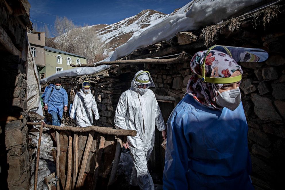 PHOTO: Doctors and nurses from the Gevas Public Health Center vaccination team walk to a house to administer the Chinese Sinovac Coronavac vaccine during a house call in the village of Daldere on Feb. 12, 2021 in Van, Turkey.