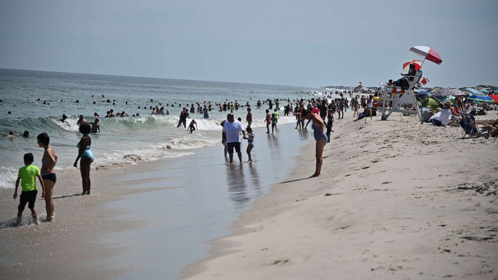 PHOTO: Beachgoers enjoy the weather at Island Beach State Park in Berkeley Township, N.J., on July 27, 2020.