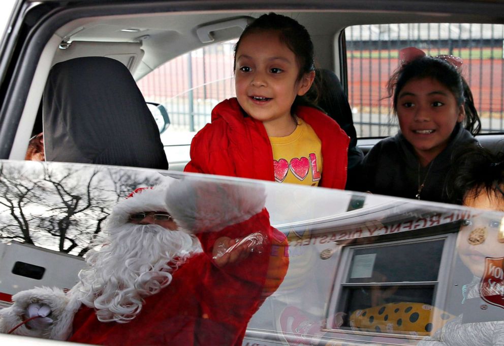 PHOTO: Children react as Santa visits The Salvation Army's food pantry at Manning Field in Lynn, Mass. to spread a little holiday cheer on Nov. 16, 2020.