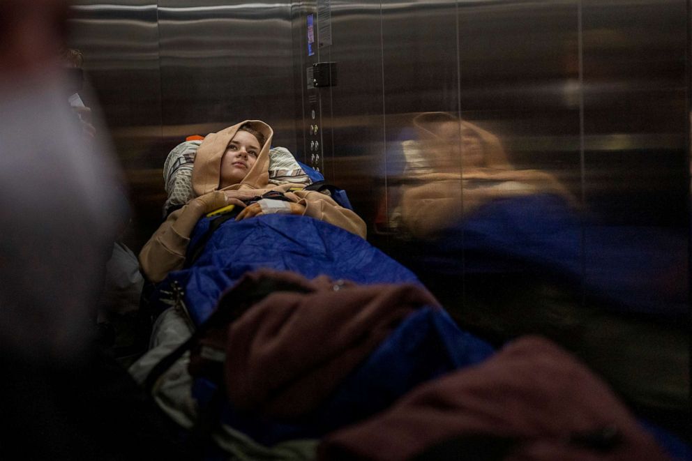 PHOTO: Nastia Kuzik, 21, is being transported by a medical team to Germany,from a hospital in Kyiv, Ukraine, May 5, 2022. She lost her right leg below the knee and seriously injured her left, after beig caught by bombing on March 17. 