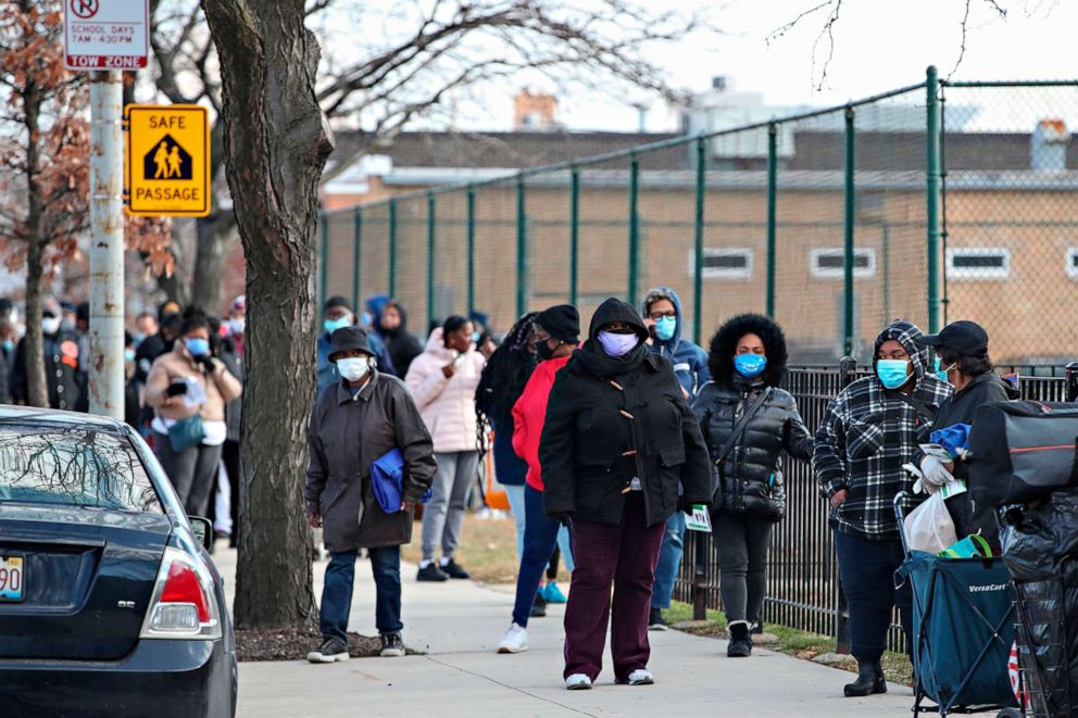 PHOTO: People wait in line to receive a free turkey on behalf of Chance The Rapper charitable foundation SocialWorks ahead of the Thanksgiving holiday in Chicago, on Nov. 23, 2020.